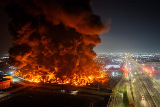 This aerial view shows a large fire at a chemical plant in the Quilicura commune of Santiago on August 4, 2026. (Photo by Javier TORRES / AFP)