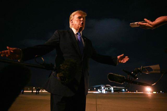 US President Donald Trump speaks with the media before boarding Air Force One en route to Las Vegas at Los Angeles International Airport in Los Angeles on August 4, 2026. US President Donald Trump is departing for Las Vegas, where he is expected to deliver remarks on August 5 at Red Rock Casino Resort & Spa in Summerlin, Nevada, promoting the administration's tax-cut policies, including the "no tax on tips" measure. (Photo by Jim WATSON / AFP)
