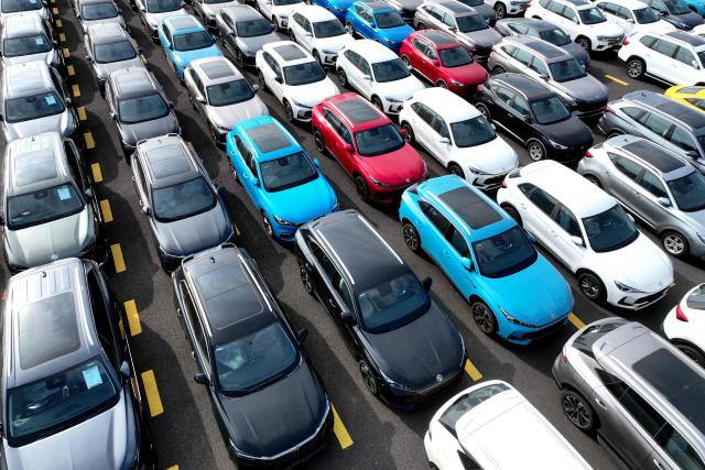 Chinese-made MG vehicles wait to be loaded onto a ship for export at a car yard at the Dongfang Port Company terminal of Lianyungang Port in Jiangsu province, eastern China on August 4, 2026 (Photo by CN-STR / AFP) / China OUT