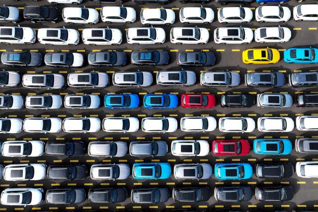 Chinese-made MG vehicles wait to be loaded onto a ship for export at a car yard at the Dongfang Port Company terminal of Lianyungang Port in Jiangsu province, eastern China on August 4, 2026 (Photo by CN-STR / AFP) / China OUT