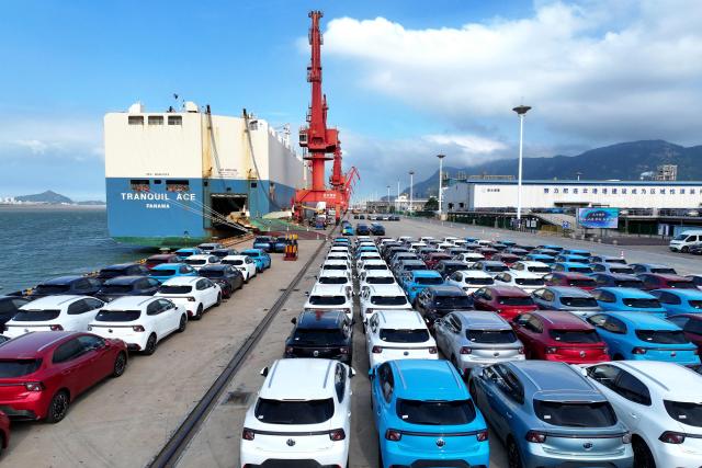Chinese-made MG vehicles wait to be loaded onto a ship for export at a car yard at the Dongfang Port Company terminal of Lianyungang Port in Jiangsu province, eastern China on August 4, 2026 (Photo by CN-STR / AFP) / China OUT