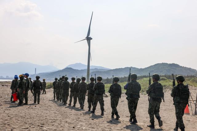 Taiwan military personnel conduct a live-fire exercise on Zhongfu Beach as part of annual Han Kuang military exercise in New Taipei City on August 5, 2026. (Photo by I-Hwa Cheng / AFP)