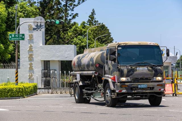 A military fuel tanker truck exits the Tsoying Naval Base to provide logistical support during the first day of the Han Kuang military exercise in Kaohsiung on August 5, 2026. (Photo by cheng-chia huang / AFP)