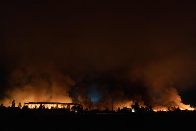 This photograph shows smoke rising from a warehouse destroyed during massive Russian ballistic missile and drone strikes on the outskirts of Kyiv early on August 5, 2026, amid the Russian invasion of Ukraine. Russian strikes on Ukraine's capital and surrounding region killed at least two people and wounded dozens more, authorities said on August 5, 2026, after fresh overnight missile and drone attacks. (Photo by Roman PILIPEY / AFP)
