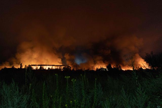 This photograph shows smoke rising from a warehouse destroyed during massive Russian ballistic missile and drone strikes on the outskirts of Kyiv early on August 5, 2026, amid the Russian invasion of Ukraine. Russian strikes on Ukraine's capital and surrounding region killed at least two people and wounded dozens more, authorities said on August 5, 2026, after fresh overnight missile and drone attacks. (Photo by Roman PILIPEY / AFP)