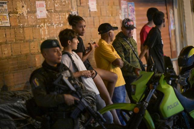 A Colombian policeman stands guard in the Melendez neighborhood prior to the upcoming presidential inauguration of Colombia's president-elect Abelardo de la Espriella, in Cali, Colombia, on August 4, 2026. De la Espriella's inauguration will take place on August 7, 2026. (Photo by JOAQUIN SARMIENTO / AFP)