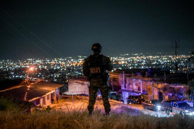 A Colombian soldier stands guard in the Melendez neighborhood prior to the upcoming presidential inauguration of Colombia's president-elect Abelardo de la Espriella, in Cali, Colombia, on August 4, 2026. De la Espriella's inauguration will take place on August 7, 2026. (Photo by JOAQUIN SARMIENTO / AFP)