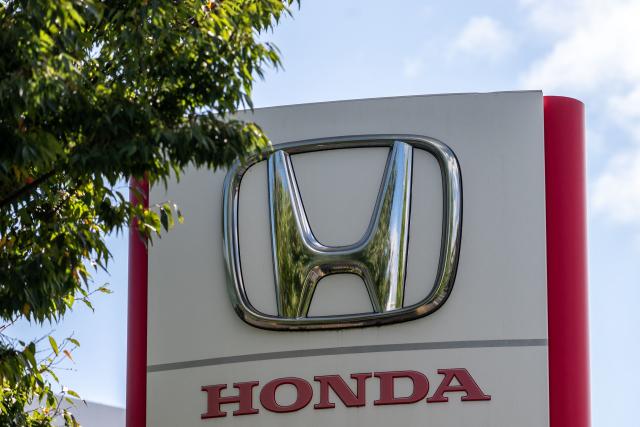 This photo shows signage at a car dealership for Japanese automaker Honda Motor along a street in Yokohama on August 5, 2026. (Photo by Philip FONG / AFP)