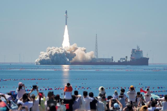 A Jielong-3 carrier rocket carrying two satellites, the Dongfang Huiyan Hyperspectral 01 and 02, lifts off from a launch ship off the coast of Haiyang in eastern China's Shandong province on August 5, 2026. (Photo by CN-STR / AFP) / China OUT