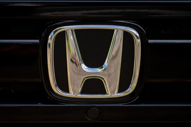 This photo shows signage on a car at a dealership for Japanese automaker Honda Motor along a street in Yokohama on August 5, 2026. (Photo by Philip FONG / AFP)