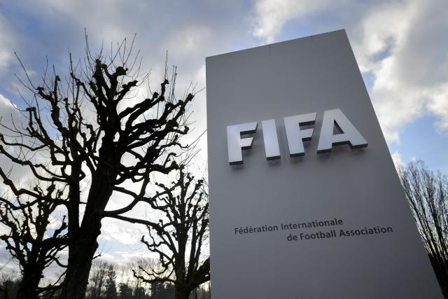 (FILES) A sign of FIFA is seen at the football's World governing body headquarters on December 17, 2015 in Zurich. President Gianni Infantino held emergency talks with other FIFA directors in Morocco on August 5, 2026, a source told AFP, amid a wave of criticism over his now shelved plan to open the World Cup to private investment. (Photo by FABRICE COFFRINI / AFP)