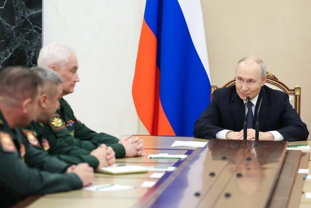 In this pool photograph distributed by the Russian state agency Sputnik, Russia's President Vladimir Putin meets with the Russian Defence Ministry leadership in Moscow on August 5, 2026. (Photo by Alexander KAZAKOV / POOL / AFP)