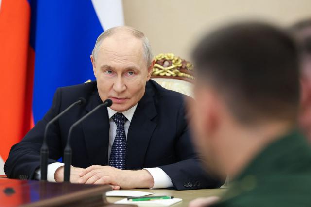 In this pool photograph distributed by the Russian state agency Sputnik, Russia's President Vladimir Putin meets with the Russian Defence Ministry leadership in Moscow on August 5, 2026. (Photo by Alexander KAZAKOV / POOL / AFP)