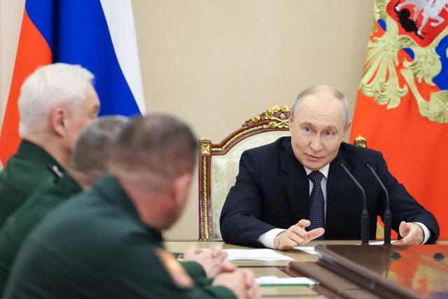 In this pool photograph distributed by the Russian state agency Sputnik, Russia's President Vladimir Putin meets with the Russian Defence Ministry leadership in Moscow on August 5, 2026. (Photo by Alexander KAZAKOV / POOL / AFP)