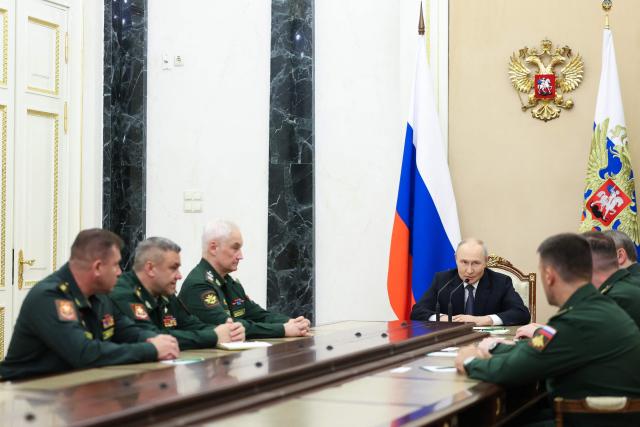 In this pool photograph distributed by the Russian state agency Sputnik, Russia's President Vladimir Putin meets with the Russian Defence Ministry leadership in Moscow on August 5, 2026. (Photo by Alexander KAZAKOV / POOL / AFP)