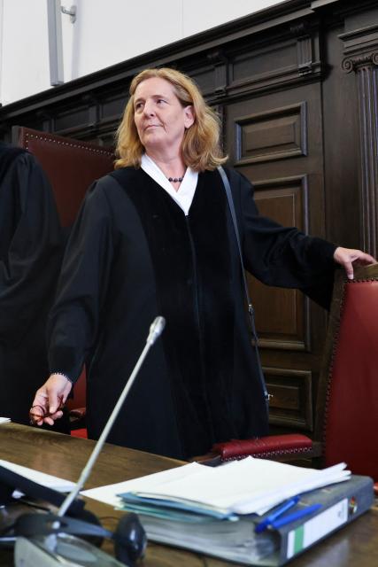 Presiding Judge at the Higher Regional Court Ulrike Taeubner arrives in the courtroom of the criminal justice building at the start of another day of hearings in the trial against the far-right terrorist group Last Wave of Defense, on August 5, 2026 in Hamburg. A German court gave prison sentences of up to five years on August 5, 2026 to seven alleged members or supporters of a German far-right militant group called the "Last Wave of Defence".
The men, all in their teens or early 20s, were convicted of crimes including membership in a terrorist organisation, attempted murder and arson for plotting attacks on refugees and left-wing activists. (Photo by Christian Charisius / POOL / AFP)