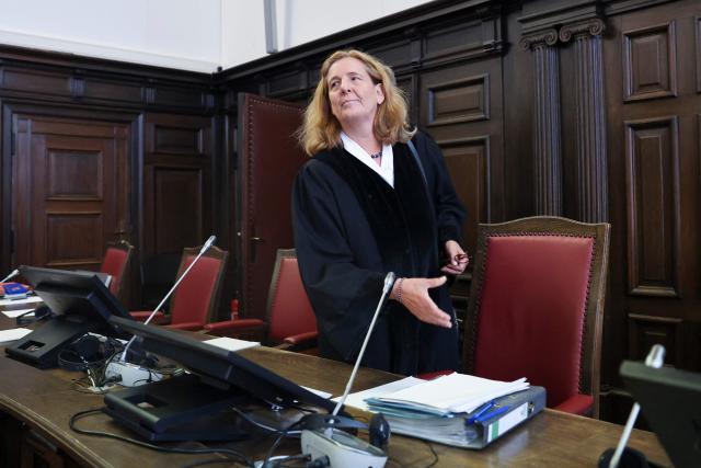 Presiding Judge at the Higher Regional Court Ulrike Taeubner arrives in the courtroom of the criminal justice building at the start of another day of hearings in the trial against the far-right terrorist group Last Wave of Defense, on August 5, 2026 in Hamburg. A German court gave prison sentences of up to five years on August 5, 2026 to seven alleged members or supporters of a German far-right militant group called the "Last Wave of Defence".
The men, all in their teens or early 20s, were convicted of crimes including membership in a terrorist organisation, attempted murder and arson for plotting attacks on refugees and left-wing activists. (Photo by Christian Charisius / POOL / AFP)