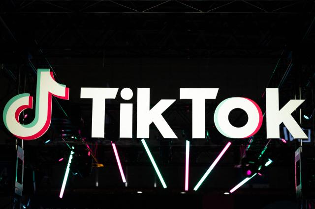 (FILES) The TikTok logo is pictured at the company's booth during the Tokyo Game Show in Chiba prefecture on September 15, 2022. The Walt Disney Co. said on August 5, 2026, that it had signed a deal with TikTok allowing users of the hugely popular video platform to add extracts of Disney films and characters in what it billed a "first-of-its-kind agreement". (Photo by Yuichi YAMAZAKI / AFP)