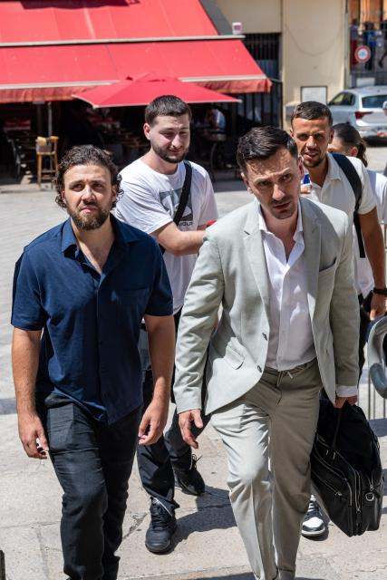 French streamer Owen Cenazandotti (L), known as Naruto, flanked by his lawyer Fabien Carles (R) arrives at the courthouse of Nice, French riviera, on August 5, 2026 for the deliberation of his trial, along with fellow streamer Safine Hamadi, known as Safine, over allegations of violence whose partner Raphael Graven, known online as Jean Pormanove, died during a live stream in August 2025. On August 5, 2026, the Criminal Court of Nice sentenced the two streamers Naruto and Safine to suspended prison terms, a fine and a six-month "digital ban" after they were tried over online violence and humiliation that preceded the death of Jean Pormanove in August 2025. (Photo by Miguel MEDINA / AFP)