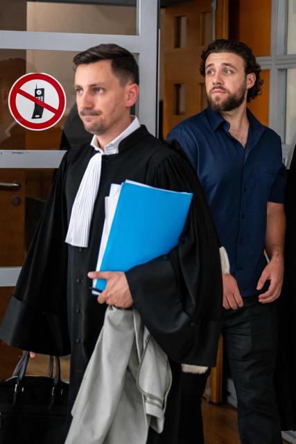 French streamer Owen Cenazandotti (R), known as Naruto, flanked by his lawyer Fabien Carles (L) leaves the courthouse of Nice, French riviera, on August 5, 2026 after the deliberation of his trial, along with fellow streamer Safine Hamadi, known as Safine, over allegations of violence whose partner Raphael Graven, known online as Jean Pormanove, died during a live stream in August 2025. On August 5, 2026, the Criminal Court of Nice sentenced the two streamers Naruto and Safine to suspended prison terms, a fine and a six-month "digital ban" after they were tried over online violence and humiliation that preceded the death of Jean Pormanove in August 2025. (Photo by Miguel MEDINA / AFP)
