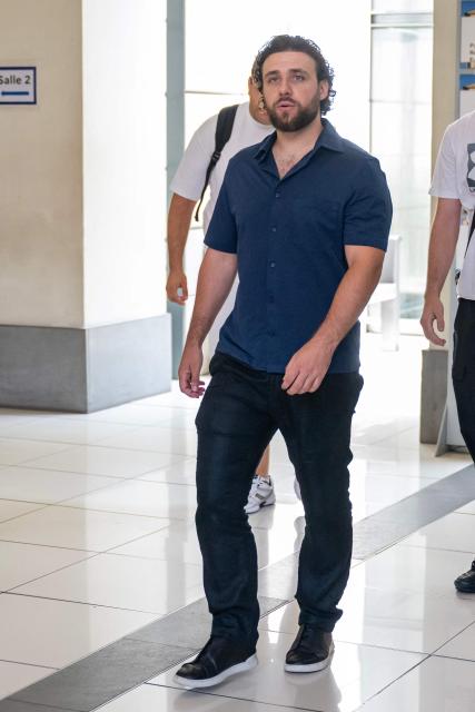 French streamer Owen Cenazandotti, known as Naruto, leaves the courthouse of Nice, French riviera, on August 5, 2026, after the deliberation of his trial, along with fellow streamer Safine Hamadi, known as Safine, over allegations of violence whose partner Raphael Graven, known online as Jean Pormanove, died during a live stream in August 2025. On August 5, 2026, the Criminal Court of Nice sentenced the two streamers Naruto and Safine to suspended prison terms, a fine and a six-month "digital ban" after they were tried over online violence and humiliation that preceded the death of Jean Pormanove in August 2025. (Photo by Miguel MEDINA / AFP)