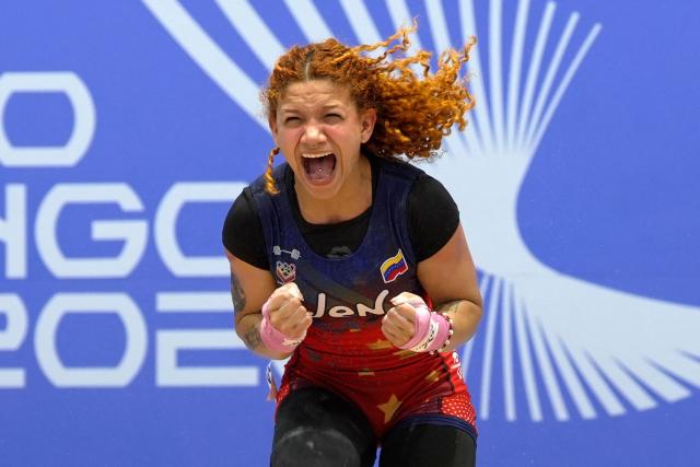 Venezuela's Patricia Mercado reacts as she competes in the women's 48Kg weightlifting event during the XXV Central American and Caribbean Games in Santo Domingo on August 5, 2026. (Photo by Francesco SPOTORNO / AFP)