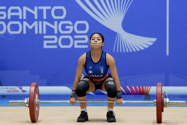Guatemala's Dulce Aquino competes in the women's 48Kg weightlifting event during the XXV Central American and Caribbean Games in Santo Domingo on August 5, 2026. (Photo by Francesco SPOTORNO / AFP)