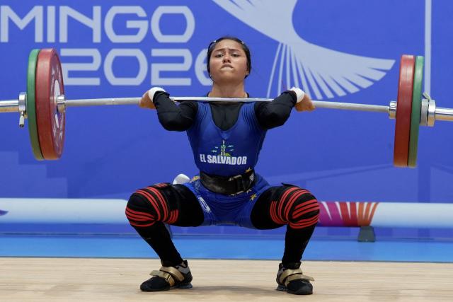 El Salvador's July Mendoza competes in the women's 48Kg weightlifting event during the XXV Central American and Caribbean Games in Santo Domingo on August 5, 2026. (Photo by Francesco SPOTORNO / AFP)
