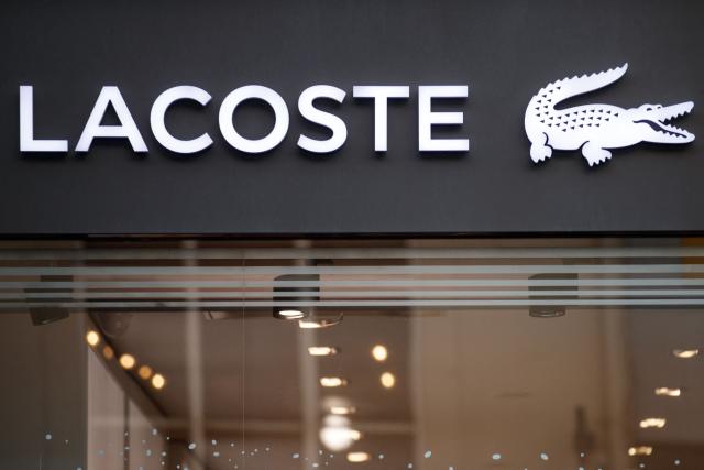 (FILES) This photograph shows the logo of Lacoste displayed on the facade of a shop in the city of Caen, northwestern of France on November 29, 2019. Lacoste has recently been hit with a Ђ9.9 million tax reassessment, according to information published on August 5, 2026, by the news media L'Informe. (Photo by Sameer Al-DOUMY / AFP)