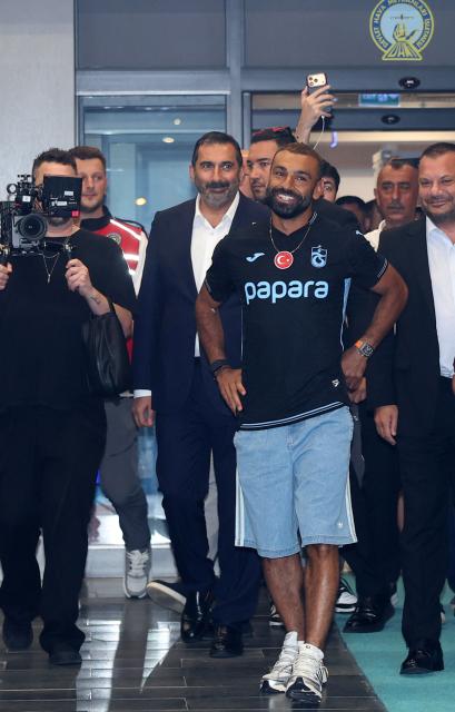 Egyptian forward Mohamed Salah arrives at arrives at Trabzon Airport to complete his transfer to Turkish football club Trabzonspor in Trabzon on August 5, 2026. (Photo by Nurgul GUNAYDIN / AFP)