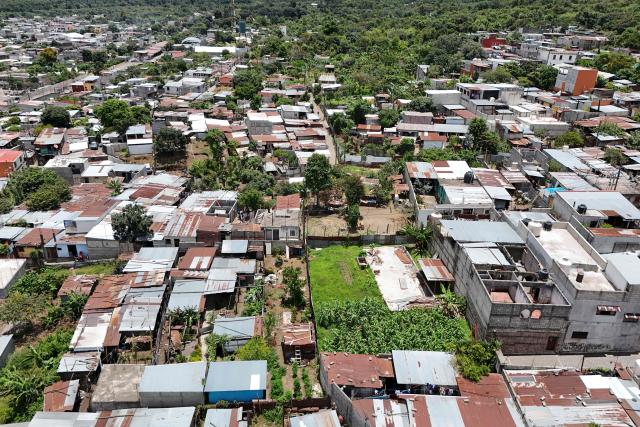 Aerial view of San Juan Alotenango on August 5, 2026, after a powerful eruption forced evacuations in the area. The eruption of Guatemala's Fuego volcano has ended after forcing a mass evacuation, the country's volcanological institute said on August 5, 2026. (Photo by Johan ORDONEZ / AFP)