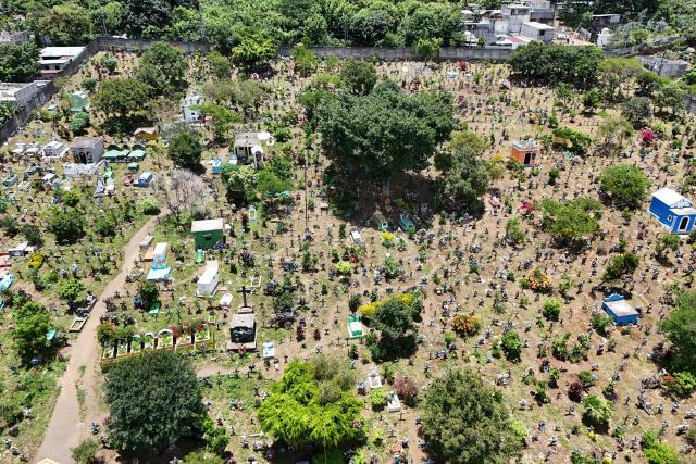 Aerial view of the municipal cemetery in San Juan Alotenango on August 5, 2026, after a powerful eruption forced evacuations in the area. The eruption of Guatemala's Fuego volcano has ended after forcing a mass evacuation, the country's volcanological institute said on August 5, 2026. (Photo by Johan ORDONEZ / AFP)