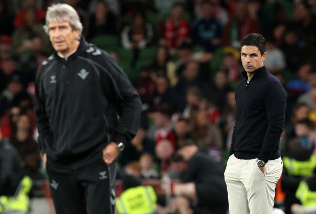 Real Betis' Chilean coach Manuel Pellegrini (L) and Arsenal's Spanish manager Mikel Arteta react during the friendly pre-season football match between Arsenal and Real Betis, at the Aviva Stadium in Dublin, Ireland on August 5, 2026.  (Photo by Paul Faith / AFP)
