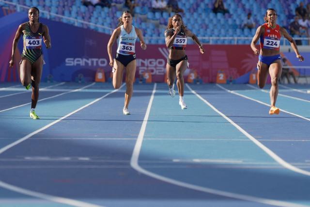 (L to R) Jamaica's Niesha Burgher, Guatemala's Mariandree Chacon, Trinidad and Tobago's Taejha Badal and Cuba's Yarima Garcia compete in the women's 200m semifinal, heat 3, during the XXV Central American and Caribbean Games at the Felix Sanchez Olympic Stadium in Santo Domingo on August 5, 2026. (Photo by Francesco SPOTORNO / AFP)