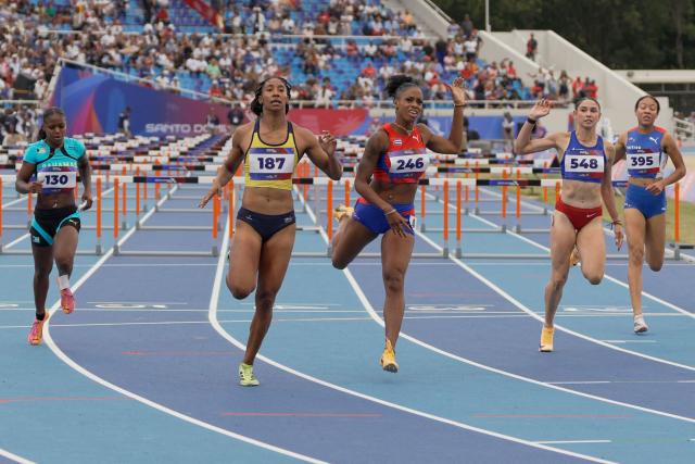 (L to R) Bahamas' Denisha Cartwright, Colombia's Maria Murillo, Cuba's Greisys Roble, Puerto Rico's Paola Vazquez and British Virgin Islands' Deya Erickson compete in the women's 100m hurdles final during the XXV Central American and Caribbean Games at the Felix Sanchez Olympic Stadium in Santo Domingo on August 5, 2026. (Photo by Francesco SPOTORNO / AFP)