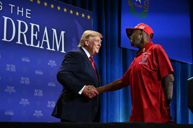 US President Donald Trump shakes hands with a member of the Teamsters Local 631 after his speach to promote his administration's recent tax-relief initiative at Red Rock Casino Resort and Spa in Las Vegas, Nevada, on August 5, 2026. (Photo by Jim WATSON / AFP)