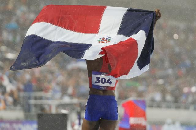 Dominican Republic's Marileidy Paulino celebrates after winning the women's 400m final during the XXV Central American and Caribbean Games at the Felix Sanchez Olympic Stadium in Santo Domingo on August 5, 2026. (Photo by Francesco SPOTORNO / AFP)