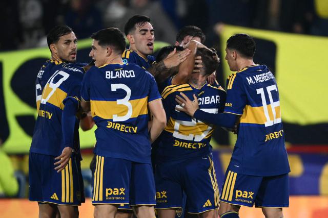 Boca Juniors' midfielder #25 Santiago Ascacibar celebrates with teammates scoring the opening goal during the Argentine Professional League 2026 Clausura football match between Boca Juniors and Estudiantes at the Tomas Adolfo Duco stadium in Buenos Aires on August 5, 2026. (Photo by Luis ROBAYO / AFP)