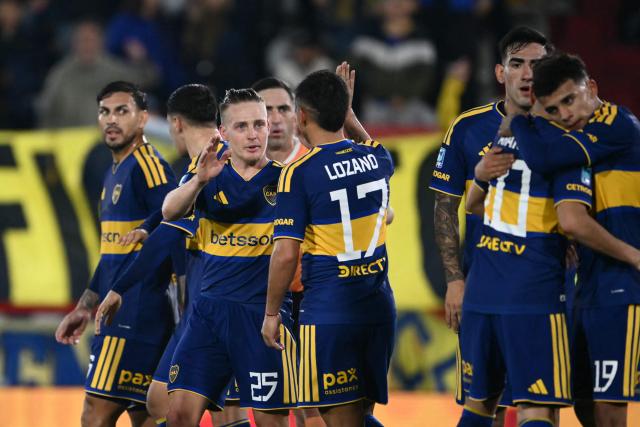 Boca Juniors' midfielder #25 Santiago Ascacibar celebrates with teammates scoring the opening goal during the Argentine Professional League 2026 Clausura football match between Boca Juniors and Estudiantes at the Tomas Adolfo Duco stadium in Buenos Aires on August 5, 2026. (Photo by Luis ROBAYO / AFP)