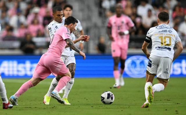 Inter Miami's Argentine forward #10 Lionel Messi (L) fights for the ball during the Leagues Cup 2026 group-stage football match between Inter Miami CF and Atletico de San Luis at Nu Stadium in Miami, Florida, on August 5, 2026. (Photo by CHANDAN KHANNA / AFP)