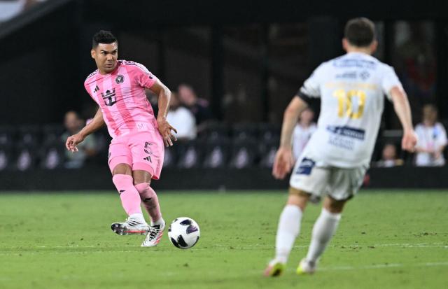 Inter Miami's Brazilian defender #05 Casemiro kicks the ball past San Luis' French midfielder #10 Sebastien Salles-Lamonge during the Leagues Cup 2026 group-stage football match between Inter Miami CF and Atletico de San Luis at Nu Stadium in Miami, Florida, on August 5, 2026. (Photo by CHANDAN KHANNA / AFP)