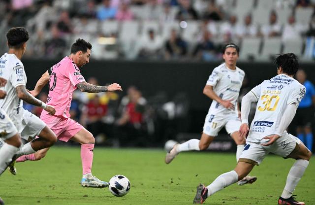 Inter Miami's Argentine forward #10 Lionel Messi controls the ball as Atletico de San Luis players defend during the Leagues Cup 2026 group-stage football match between Inter Miami CF and Atletico de San Luis at Nu Stadium in Miami, Florida, on August 5, 2026. (Photo by CHANDAN KHANNA / AFP)