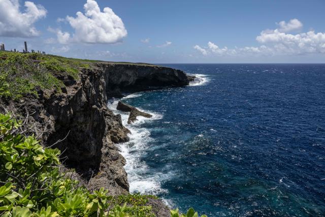 (FILES) This picture taken on June 27, 2024 shows a general view of Banzai Cliff along the coast in Saipan, Northern Mariana Islands. Commonwealth of Northern Mariana Islands Governor David Apatang says there were "no consultations" before the US announced swathes of nearby ocean could be auctioned for deep-sea mining exploration, telling AFP the industry faced strong opposition among his people. (Photo by Yuichi YAMAZAKI / AFP)