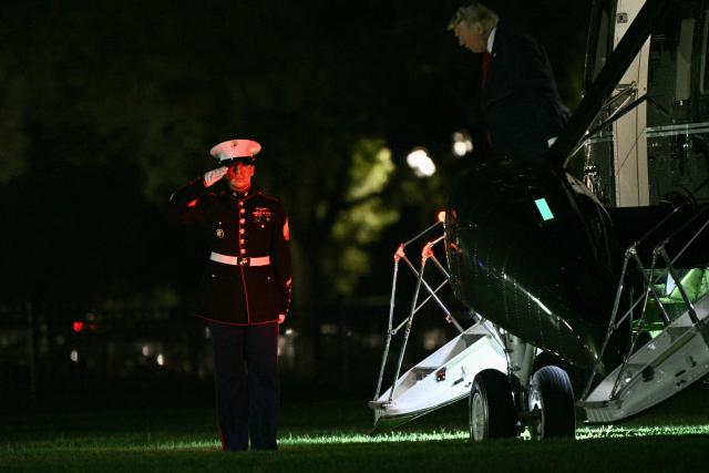 US President Donald Trump steps off Marine One on the Ellipse near the White House in Washington, DC, on August 5, 2026. Trump is returning to the White House after promoting the administration’s tax-cut policies, including the "no tax on tips" in Las Vegas. (Photo by Brendan SMIALOWSKI / AFP)