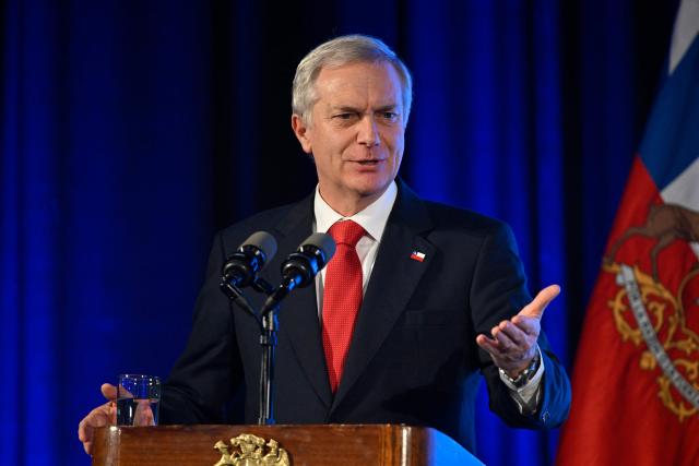 (FILES) Chile's President Jose Antonio Kast delivers a speech during a breakfast organized by the Association of Marketing Executives of Uruguay (ADM) in Montevideo on July 2, 2026. On August 5, 2026, Chilean President Jose Antonio Kast announced in a message to the nation that he will push for a package of reforms in Congress to combat organized crime, one of his key campaign promises. (Photo by Santiago Mazzarovich / AFP)