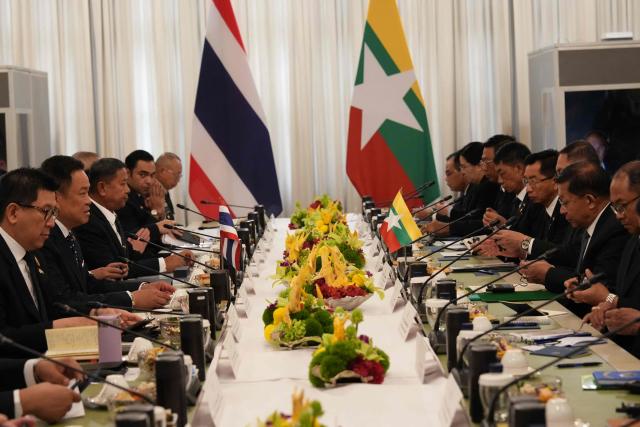Thailand's Prime Minister Anutin Charnvirakul (2nd L) speaks during a bilateral meeting with Myanmar's President Min Aung Hlaing (2nd R) at Government House in Bangkok on August 6, 2026. (Photo by Sakchai Lalit / POOL / AFP)