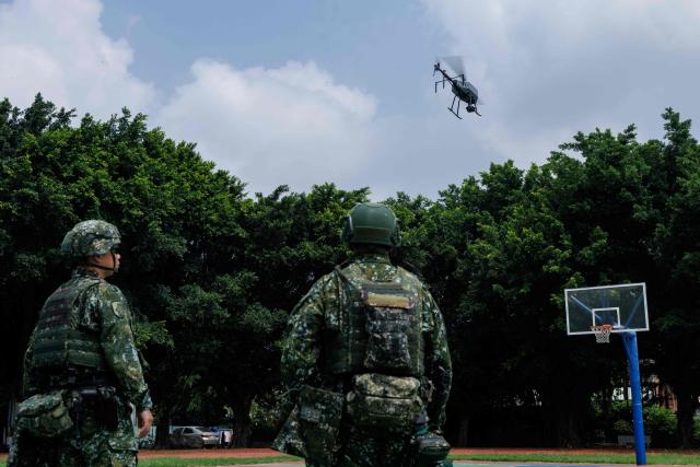 A Taiwanese military Tactical-2 unmanned aerial vehicle (UAV) flies during a combat-readiness training in Chang-Hua County on August 6, 2026. The annual "Han Kuang" exercise, which runs from August 5-14, stages combat scenarios for troops and reservists to practise responding to an attack on the island, defence officials say. (Photo by CHENG Yu-chen / AFP)