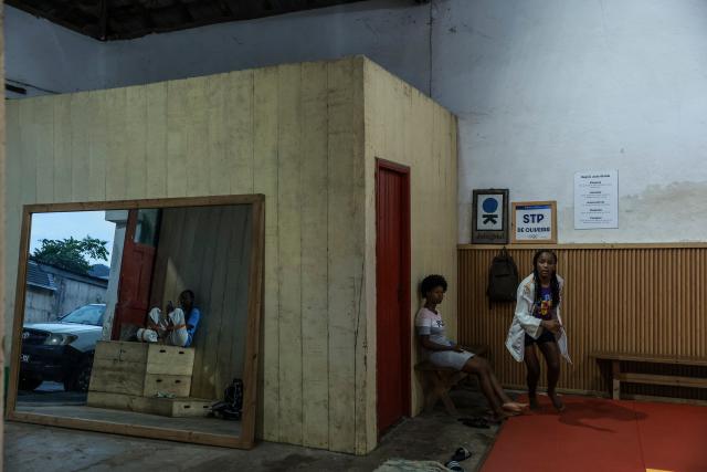A general view of young judokas in one of Judo Global dojo before their workout starts, in Santo Antonio, in Principe Island in Sao Tome and Principe, on August 5, 2026. Andre Mendes Rosa, president and founder of Judo Global, set up the association to enable young people to discover the sport and develop through sport and education. The organisation now has six centres, three on the island of Sao Tome and three on the island of Principe. It is recognised by the International Judo Federation, and athletes from Judo Global centres take part in national, regional and even international competitions with a judoka from Sao Tome and Principe, for the first time, took part in the Olympic Games in Paris in 2024. (Photo by Daniel BELOUMOU OLOMO / AFP)