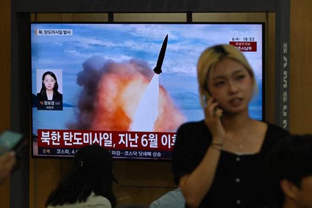 News coverage showing file footage of a North Korean missile launch is seen on a screen at a train station in Seoul on August 6, 2026. North Korea fired a short-range ballistic missile over the Sea of Japan on August 6, Seoul's military said, with the launch coming after Pyongyang lambasted Japan's military build-up in the Pacific. (Photo by GREG BAKER / AFP)