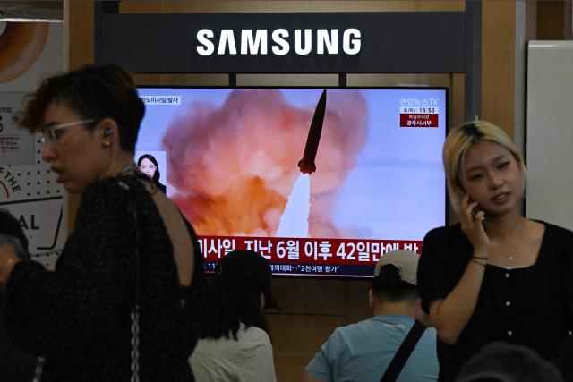 News coverage showing file footage of a North Korean missile launch is seen on a screen at a train station in Seoul on August 6, 2026. North Korea fired a short-range ballistic missile over the Sea of Japan on August 6, Seoul's military said, with the launch coming after Pyongyang lambasted Japan's military build-up in the Pacific. (Photo by GREG BAKER / AFP)